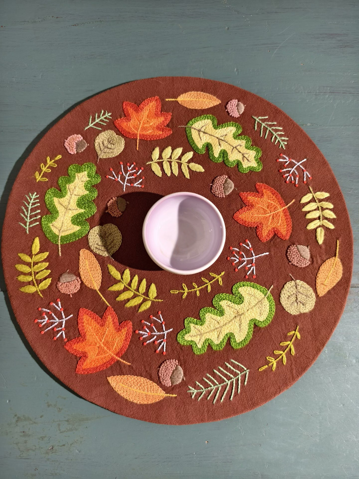 Hand-embroidered plant-dyed linen placemat